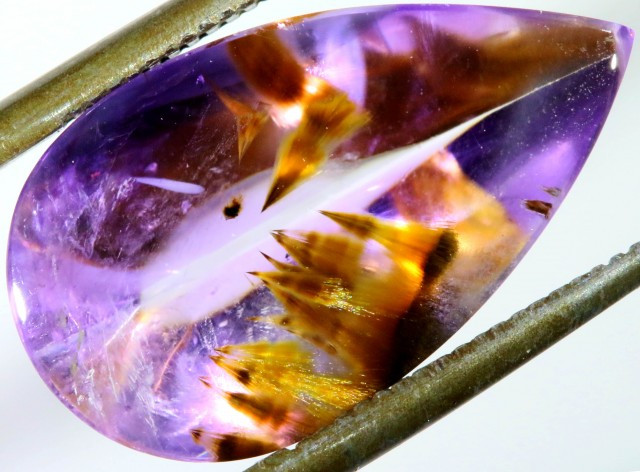 goethite inclusions in amethyst gemstone faceted