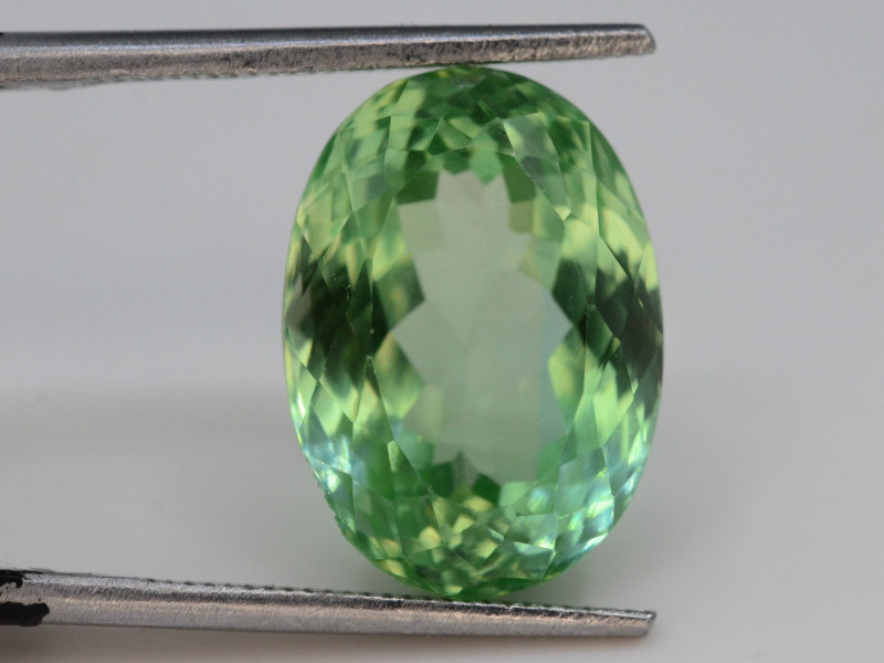 green hiddenite gemstone faceted