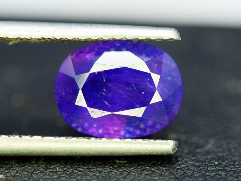 bright bluish purple sapphire gemstone faceted