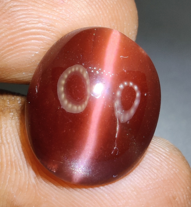 red-orange cat's eye scapolite gemstone