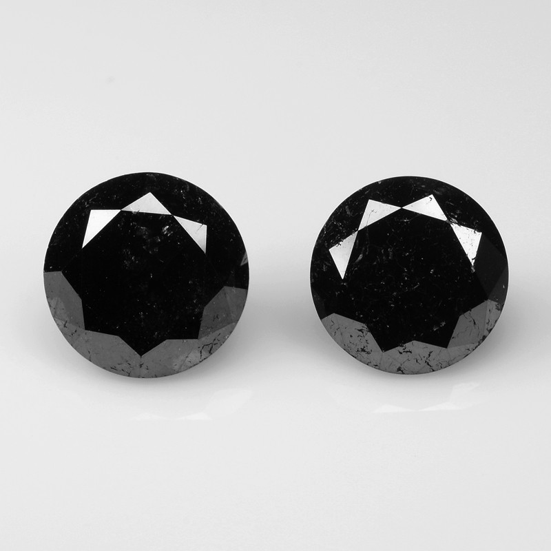 black diamond faceted gemstone pair