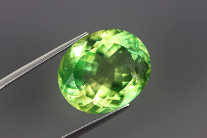 bright green euclase gemstone faceted