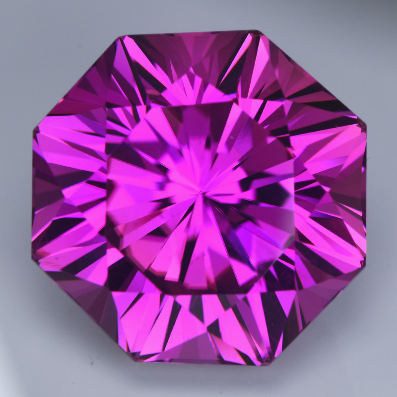 bright purple kunzite gemstone faceted