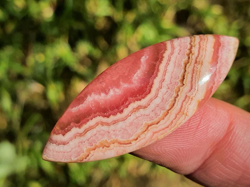 banded rhodochrosite gemstone cabochon