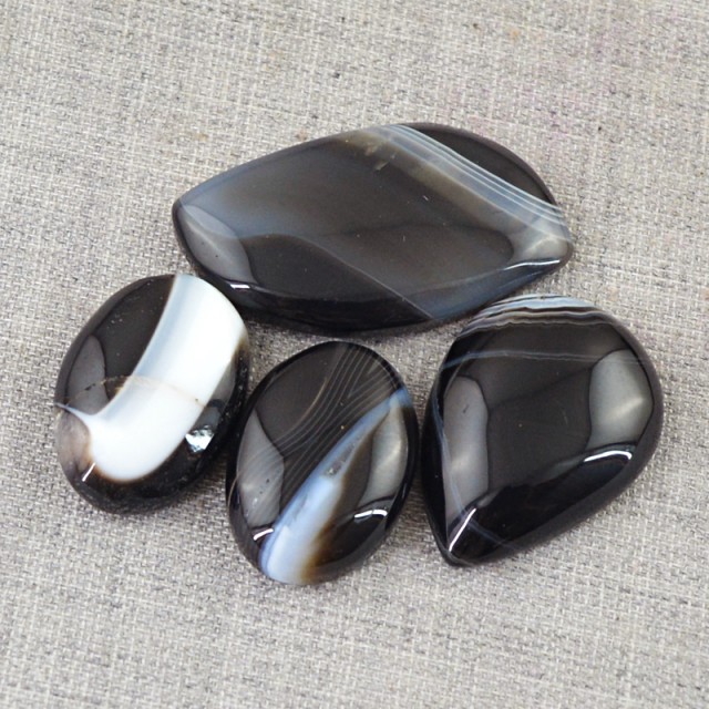 black and gray banded onyx cabochon parcel