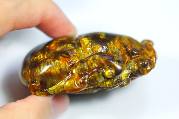 golden black coral gemstone carving of gourd