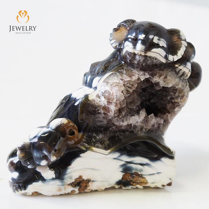 black and white jasper carving of koalas