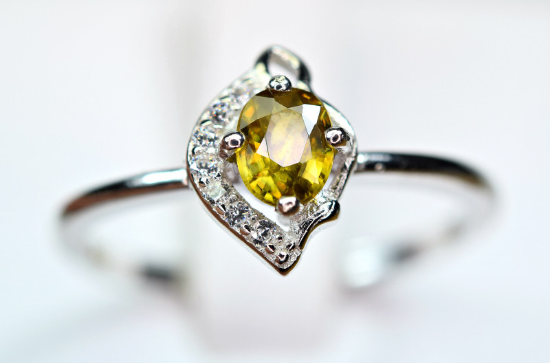 golden orange sphene titanite gemstone ring with cubic zirconia