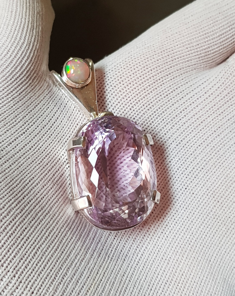 light pink kunzite gemstone pendant with precious opal