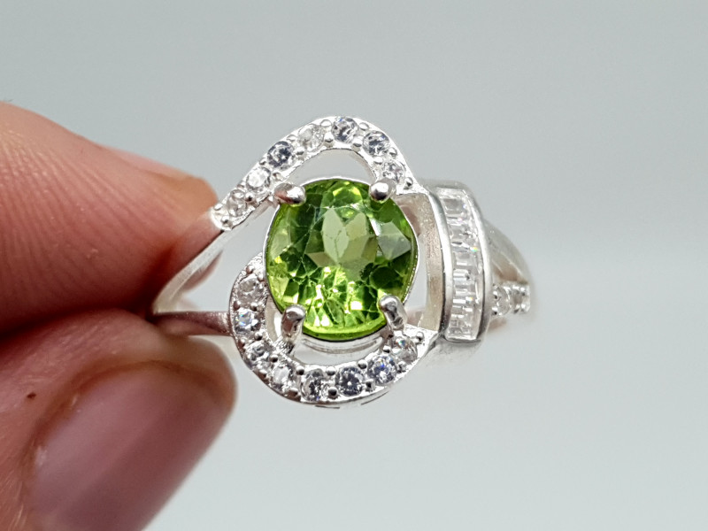 faceted olivine peridot gemstone ring with cubic zirconia